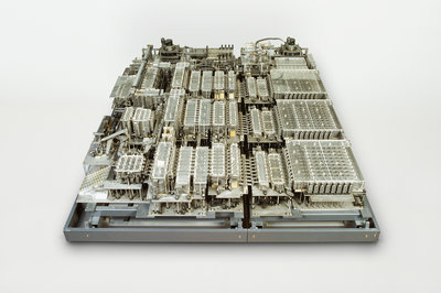 Thousands of silvery-gray mechanical relays form the heart of the first computer, the Zuse Z1. They are mounted in a metal frame.