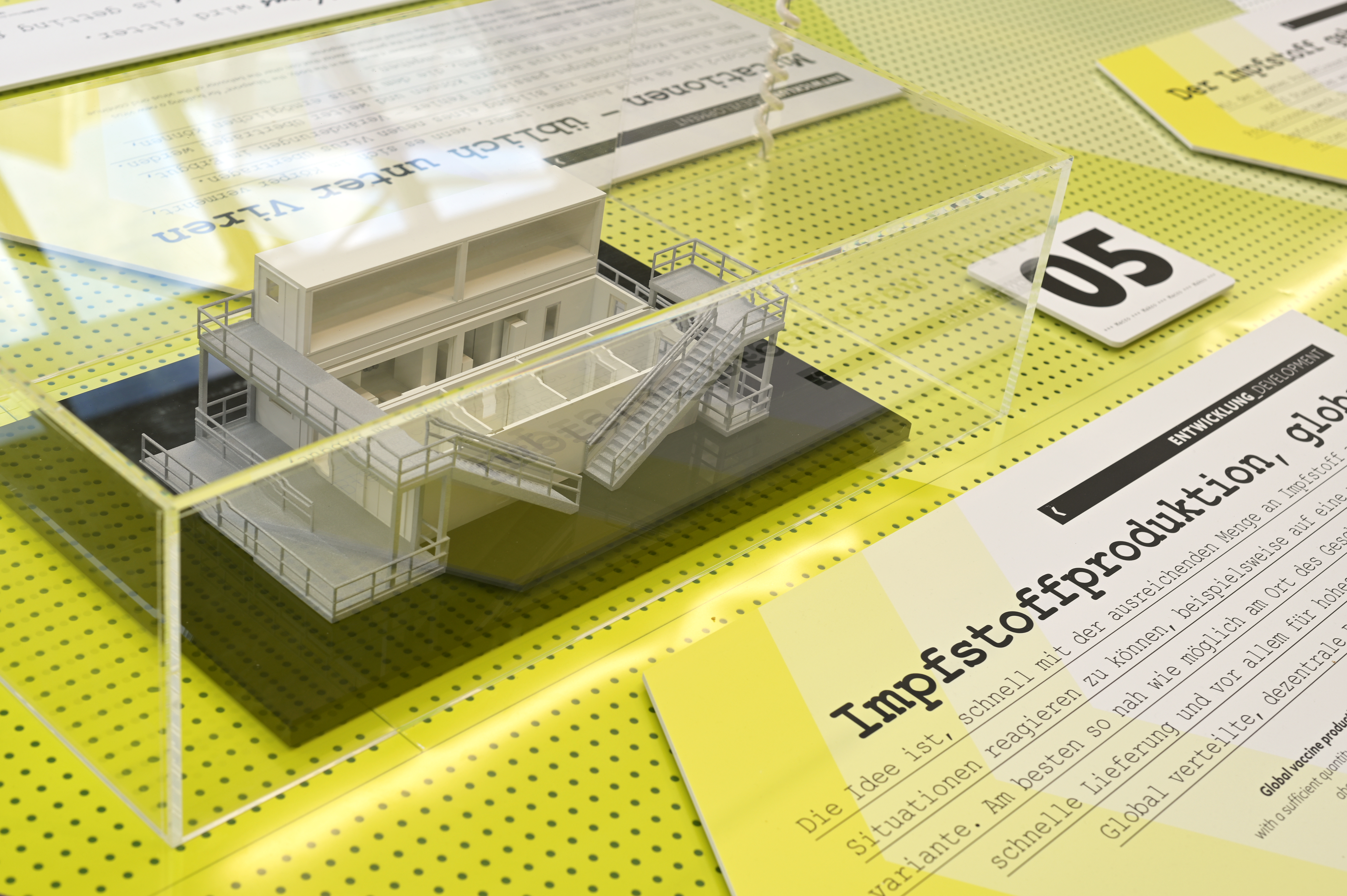 A model of the BioN-Tainer, the mobile production facility for the COVID-19 vaccine, on the display table.