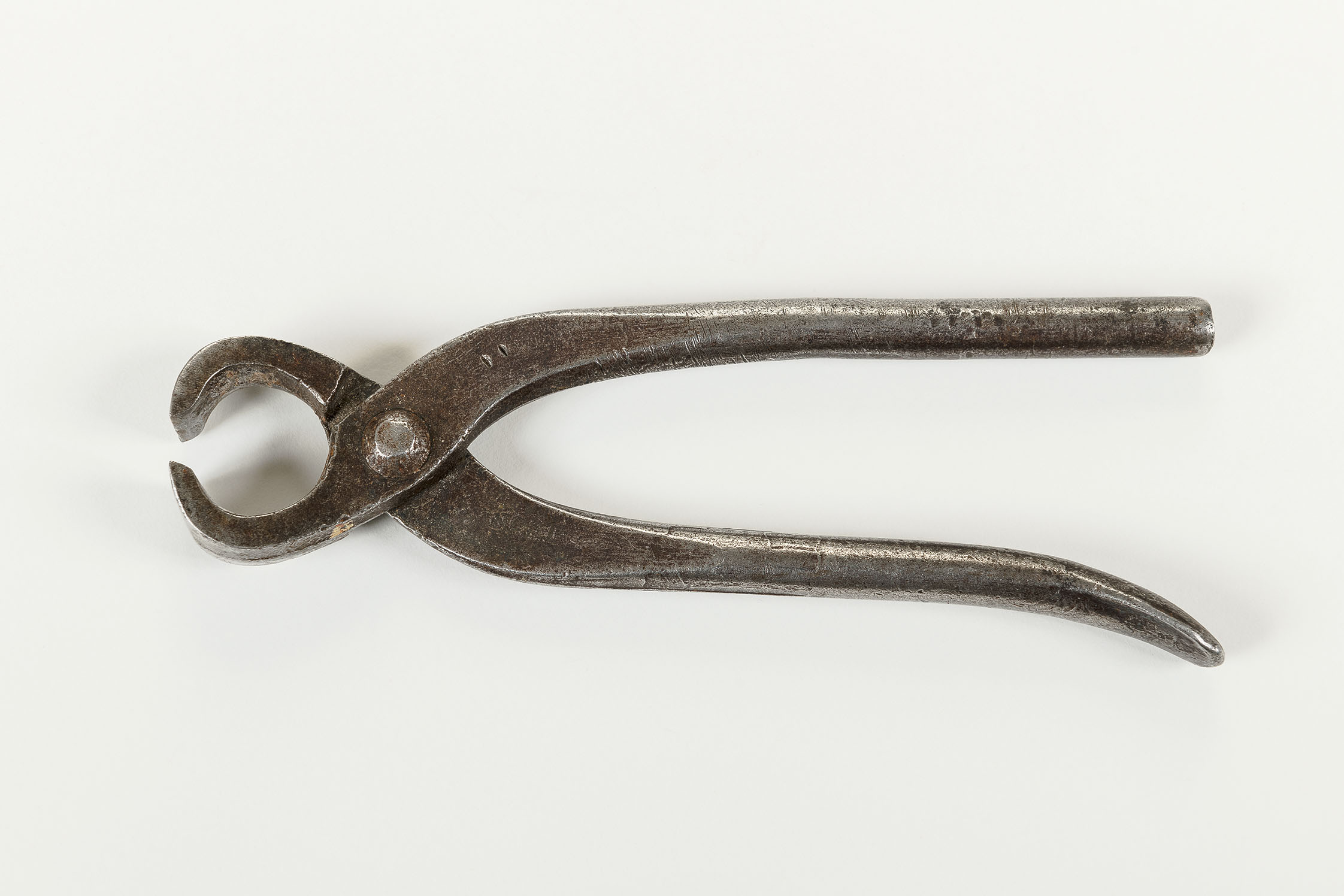 The picture shows an old pair of pliers.